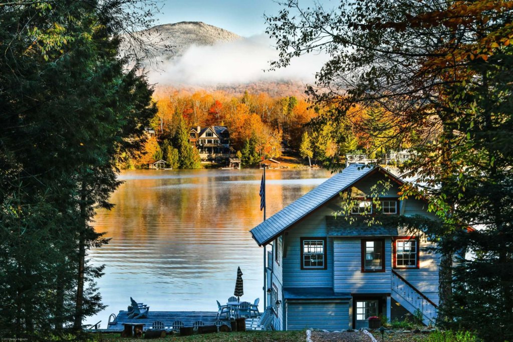 A wooded watefront home with direct lake and mountain views in autumn