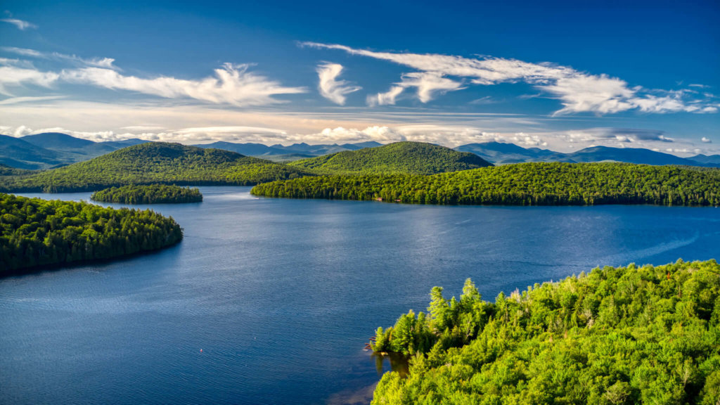 A beautiful aerial view of an Adirondack region lake on a bright summer's day