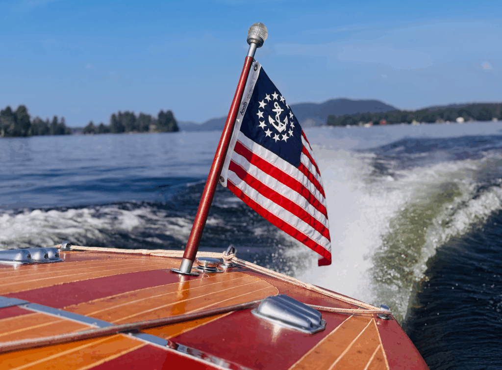 Yacht Ensign of the United States on the stern of a boat in an Adirondack lake